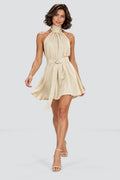 Elodie Halter Mini Dress in Beige – studio movement view