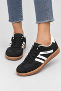 Mila Walking Sneakers in Black – model standing
