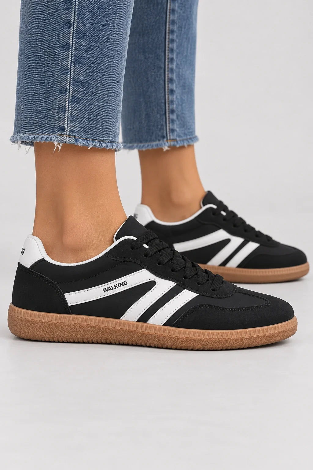 Mila Walking Sneakers in Black – model side profile